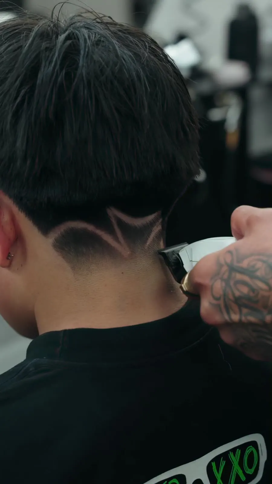 Detailed hair design on a skin fade